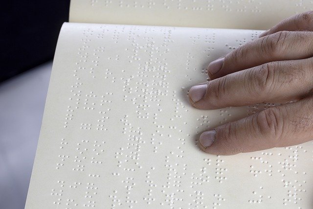 person reading braille
