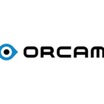 OrCam logo. The word orcam in all caps with a sideways blue tear drop shape to the right with a black circle in the center.